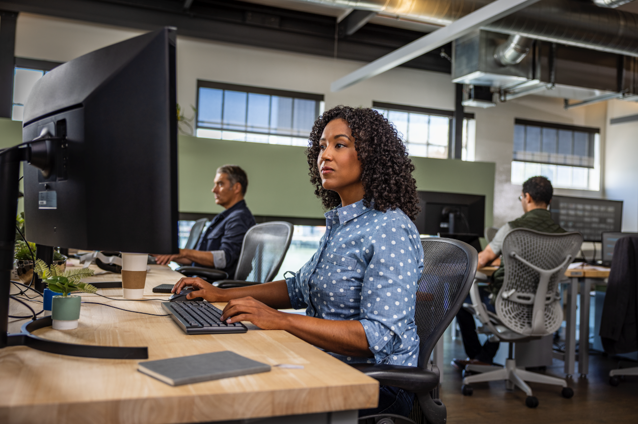 Woman sitting at desk working on the computer